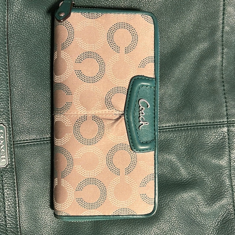 Coach long zipper around wallet with signature canvas and green leather trim.